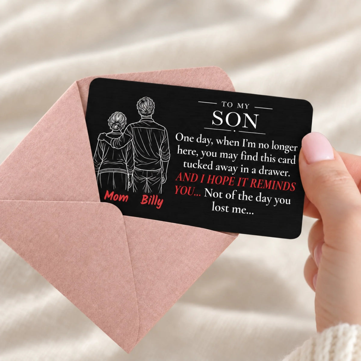 Personalized black metal wallet card for son from mom with custom names, shown with gift envelope
