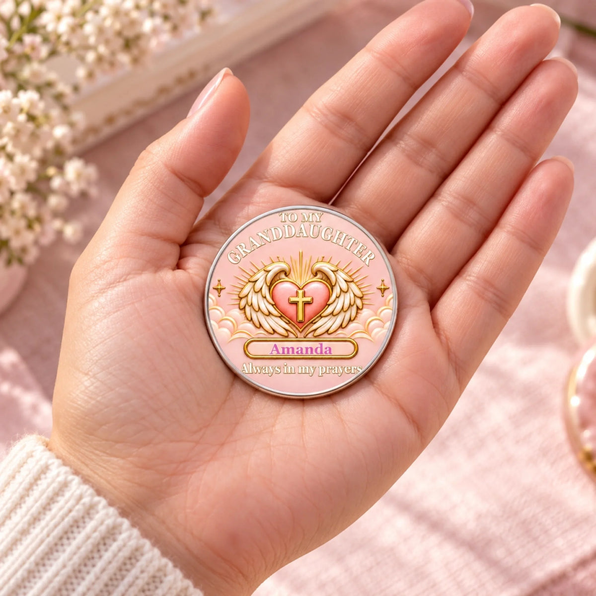Personalized granddaughter prayer pocket hug coin with angel wings and cross displayed in an open hand