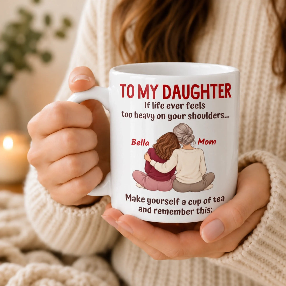 Woman holding a personalized To My Daughter coffee mug with custom mother and daughter illustration.